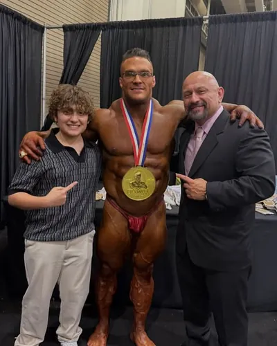 Hany Rambod backstage with Nick Walker after his Mr. Olympia win