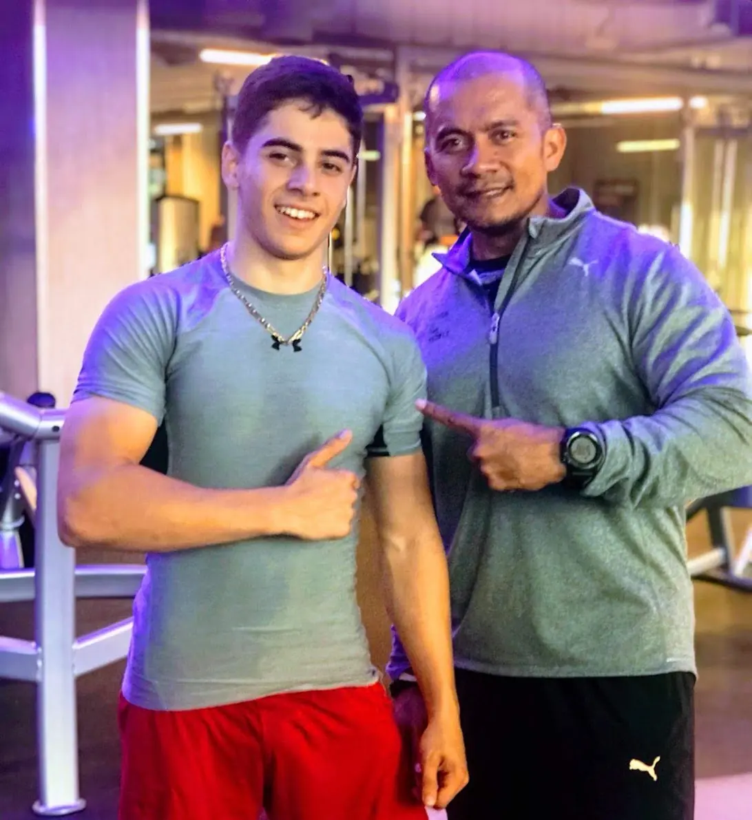 Emad with a coach in the gym