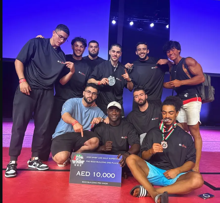 The team on stage with the AED 10,000 prize board