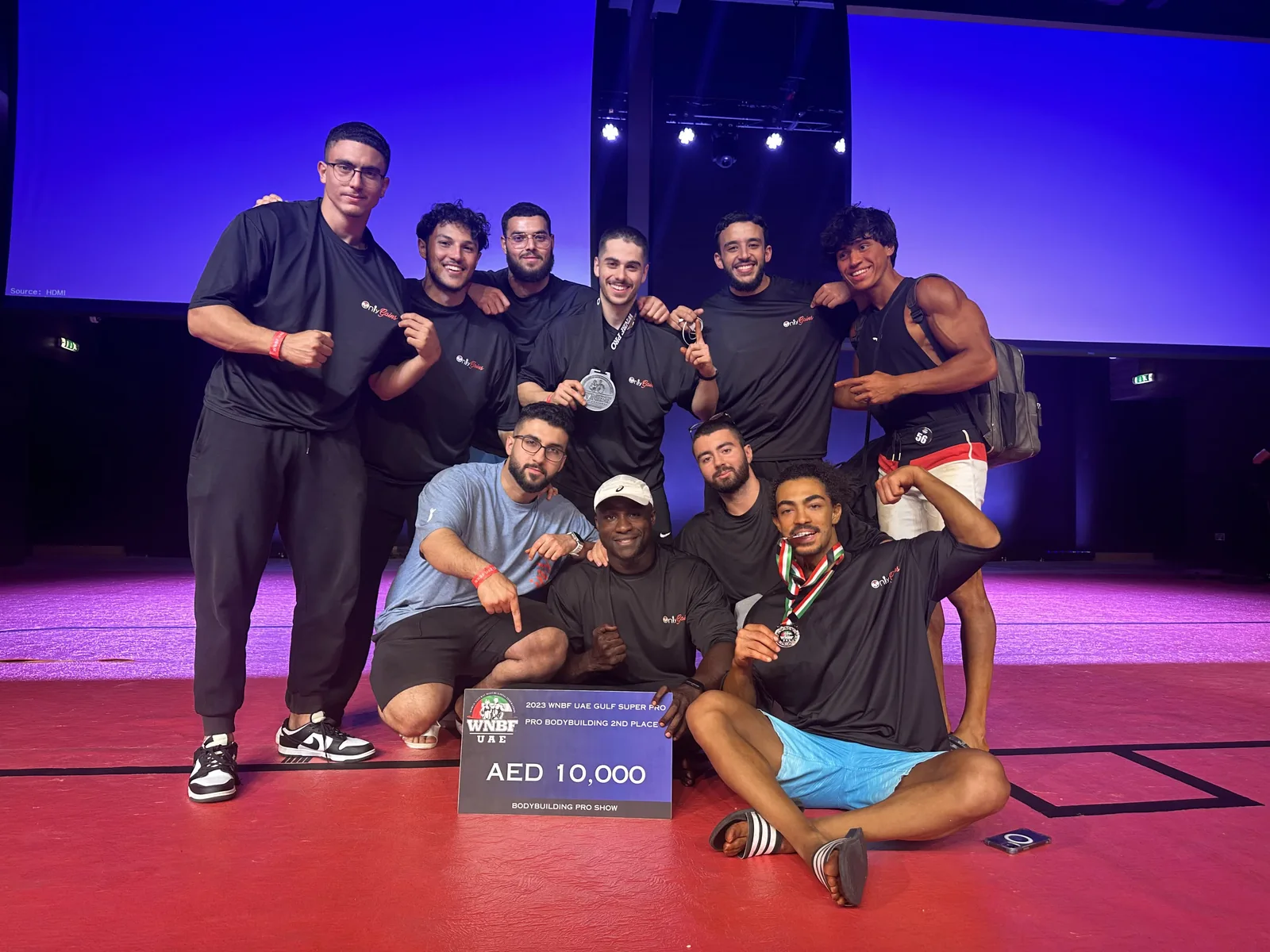 The Only Gains team on stage at the WNBF UAE Gulf Super Pro